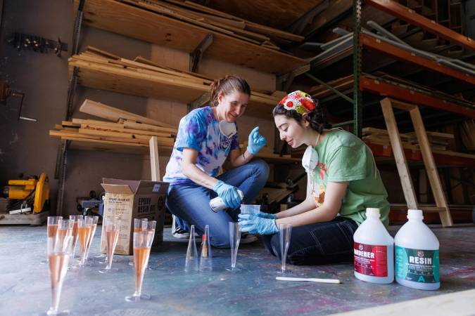 Production manager Lauren Cushman (left) and student prop master Avery Anger ’25