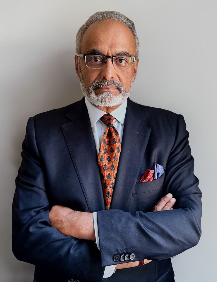 Professional headshot of Anil Menon