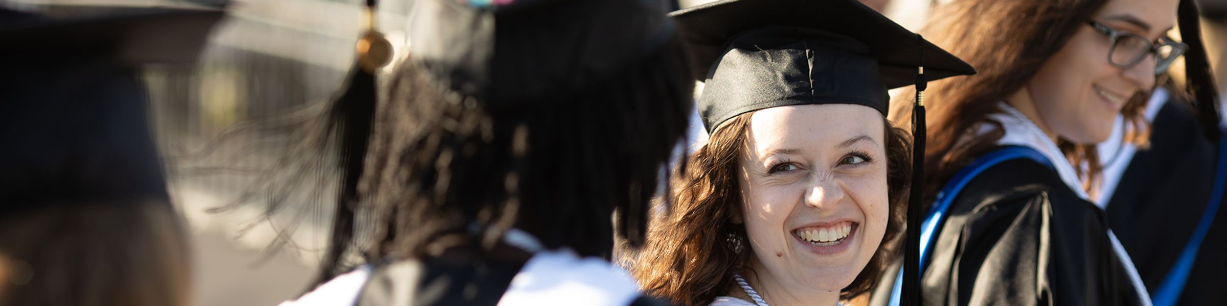 Rollins college graduates in line at commencement. 