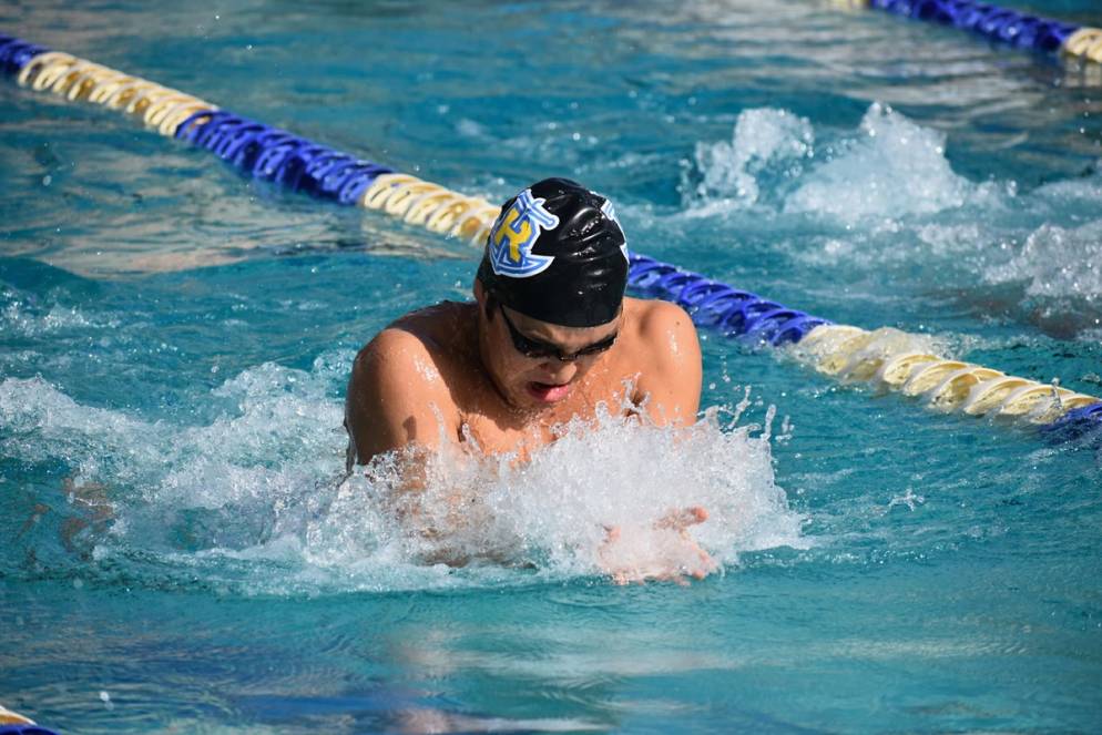 Connor Xu competing in a swim meet.