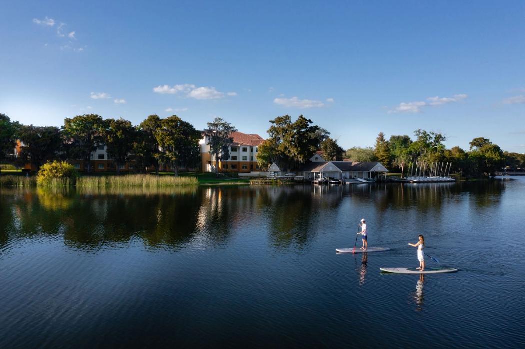 Students paddleboarding on Lake Virginia.