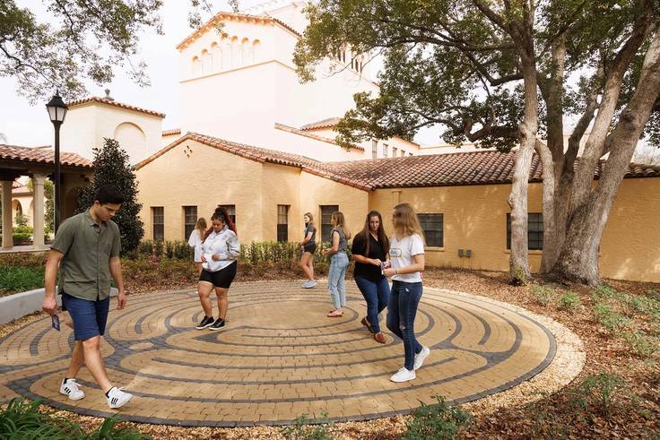 Students take a stroll around the Rollins labyrinth