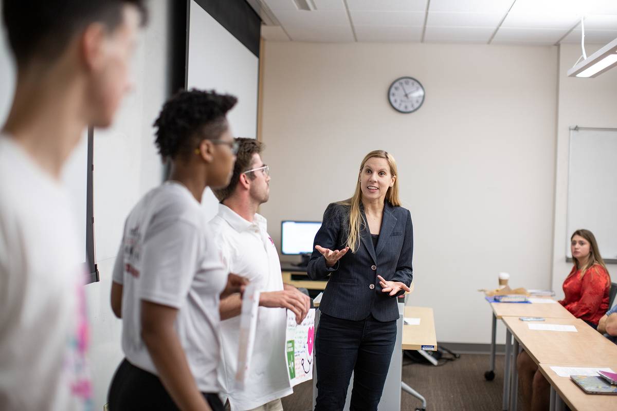 Rollins professor speaks to students in a classroom