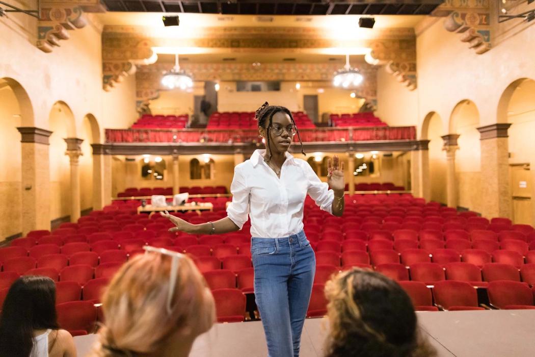 A Rollins student director discussing a scene with other students.