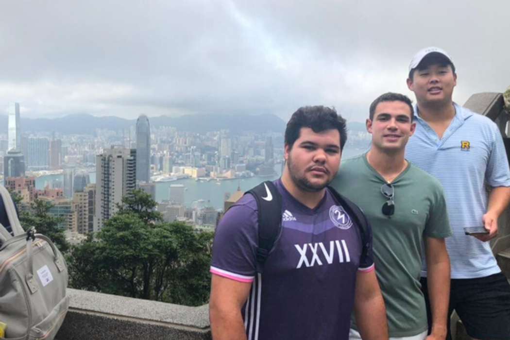 Students on an overlook point, looking down to Hong Kong.