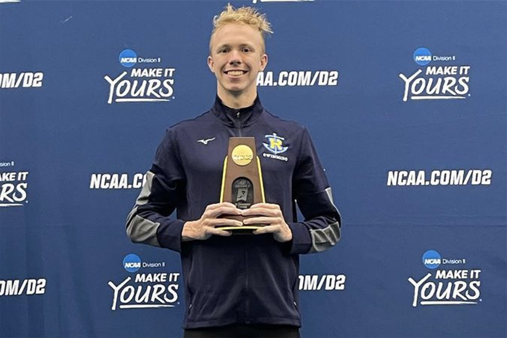 Harold Lockhart ’24 receives a trophy at the NCAA Championship.