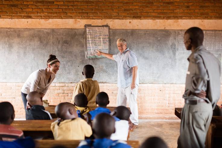 Scott Hewit teaching schoolchildren in Rwanda on a field study through Rollins.