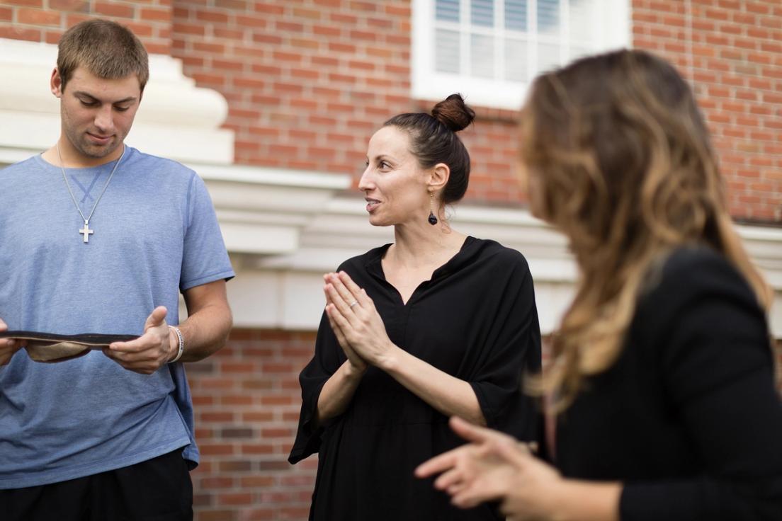 Julie Colombino ’18MBA, founder and president of Deux Mains, collaborates with students at the ethical fashion brand’s downtown Orlando headquarters.