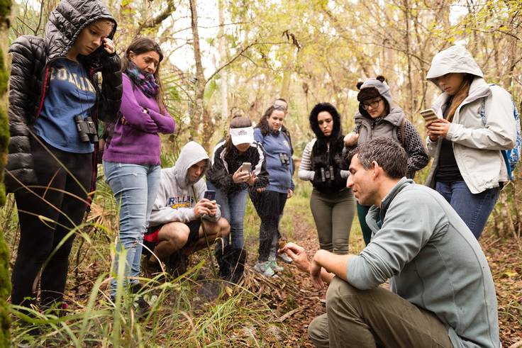 Students study wildlife in the field with biology professor Bobby Fokidis.
