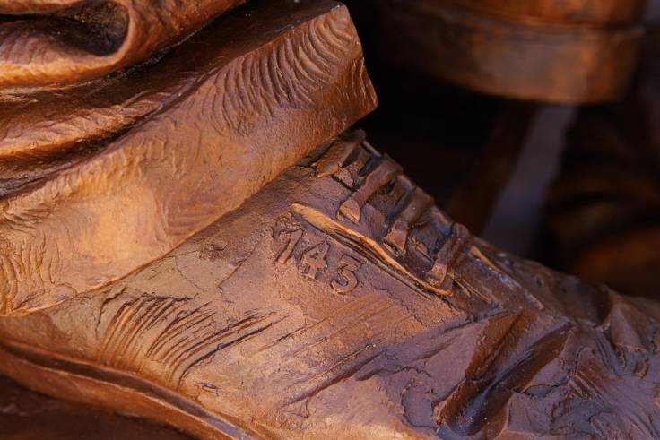 "143" detail on the shoe of a bronze sculpture honoring the life and legacy of Mister Rogers.