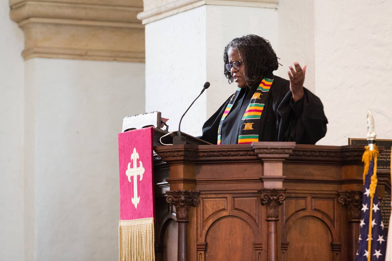 Rev. Katrina Jenkins, Rollins' dean of religious life, speaks from the pulpit in Knowles Memorial Chapel. 