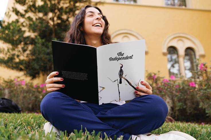 Charlize Asmar reading The Independent, Rollins’ student-run magazine.