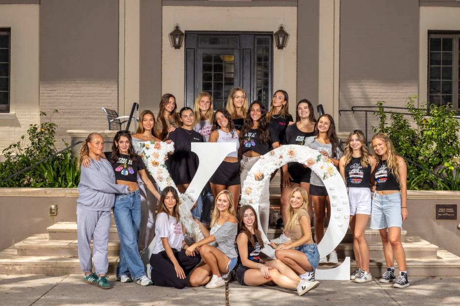 Chi Omega Sorority sisters together near Lake Virginia on Rollins campus.