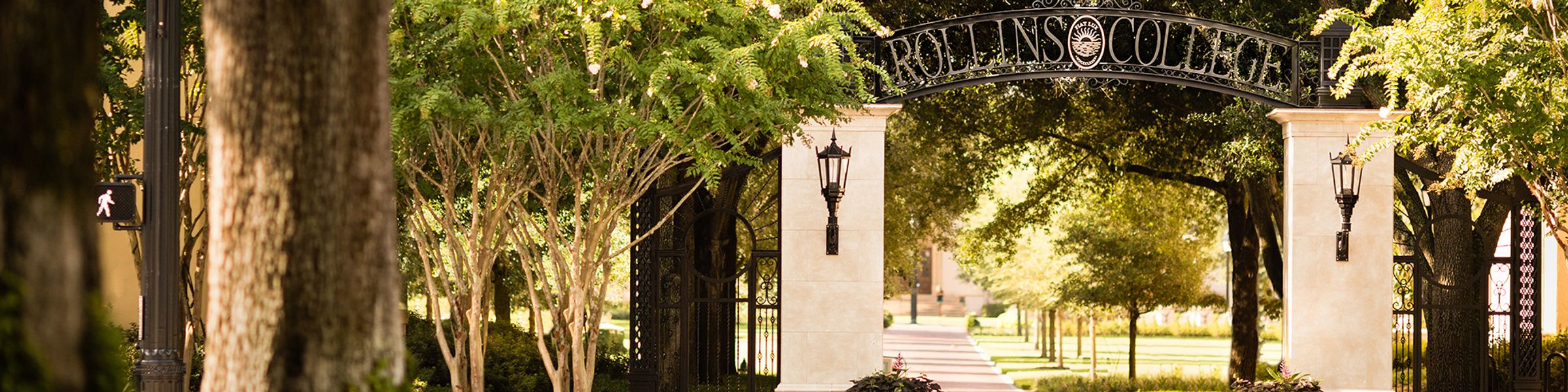 An archway at the entrance of the Rollins College campus.