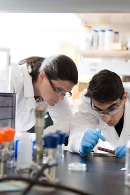 Yassine Acoine ’19 and chemistry professor Anne Murdaugh perform student-faculty research in a lab.