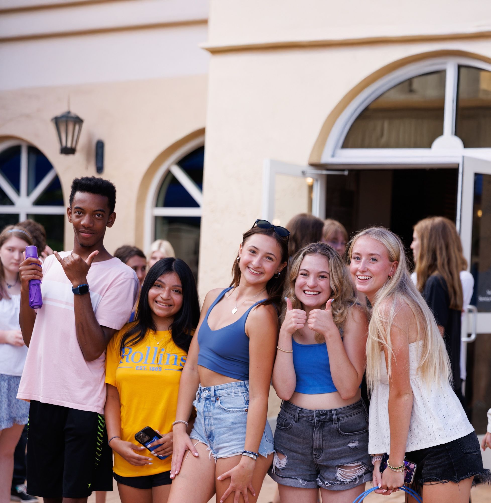 Rollins College students smiling at camera.