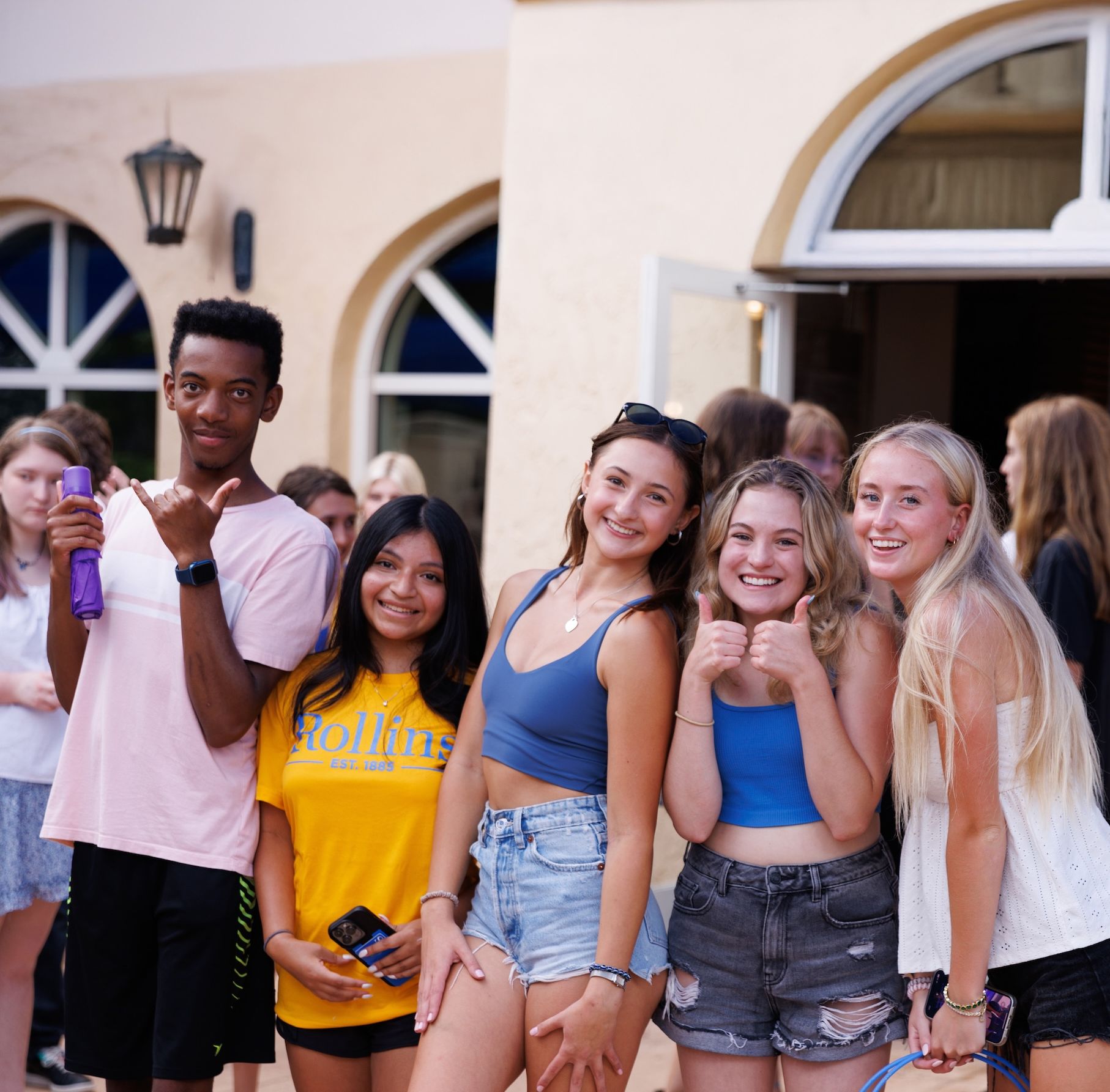 Rollins College students smiling at camera.