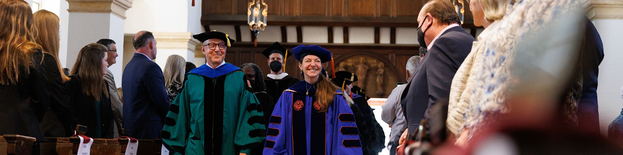 Two rows of professors walk into Rollins’ chapel during the Phi Beta Kappa induction ceremony.