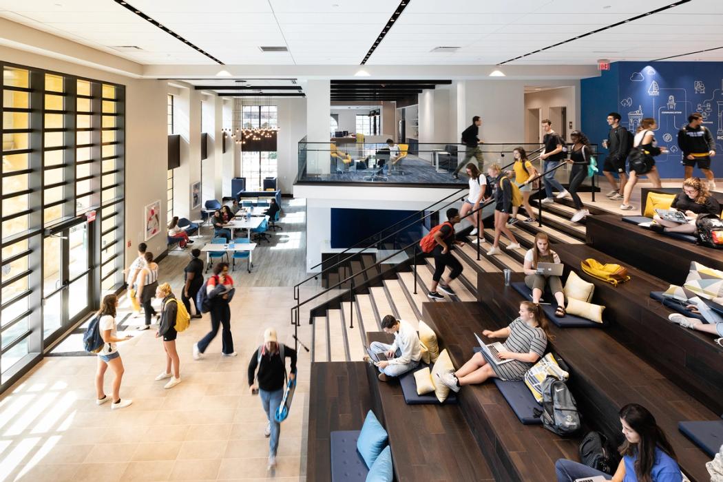 Students walk up the stairs in Kathleen W. Rollins Hall.