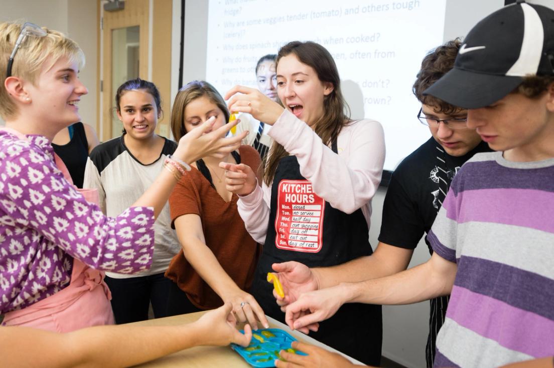 Students unmold the fish gummies they just made.