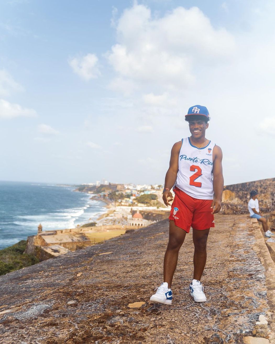 A Rollins College student poses on the beach while studying abroad in Puerto Rico. 