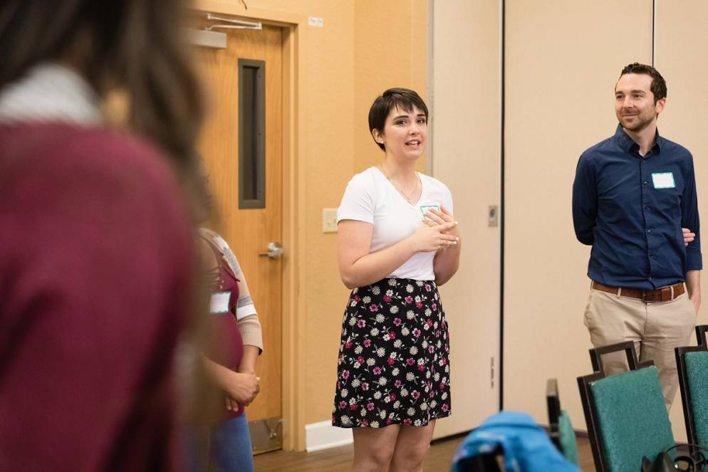 A students speaks to a group at the Hope Community Center.