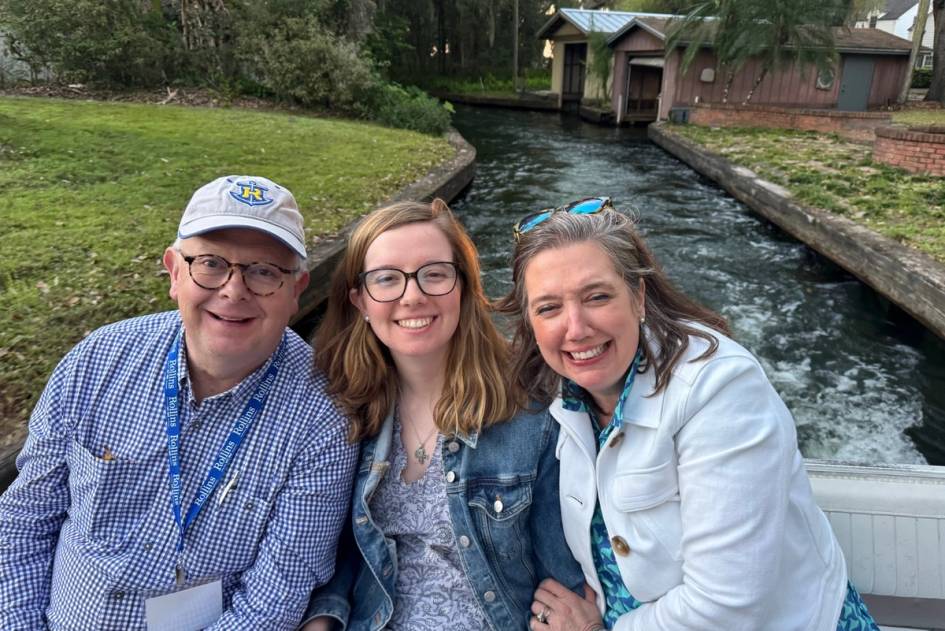 Rollins family laughing and enjoying a Winter Park boat ride.