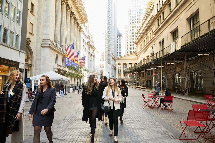Members of the Women in Finance program stroll through the Financial District in New York City. 