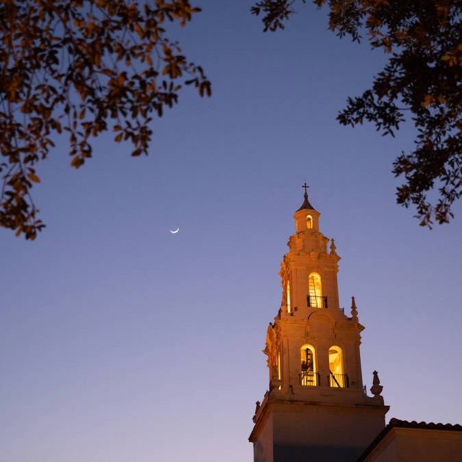 Knowles Memorial Chapel bathed in orange light.