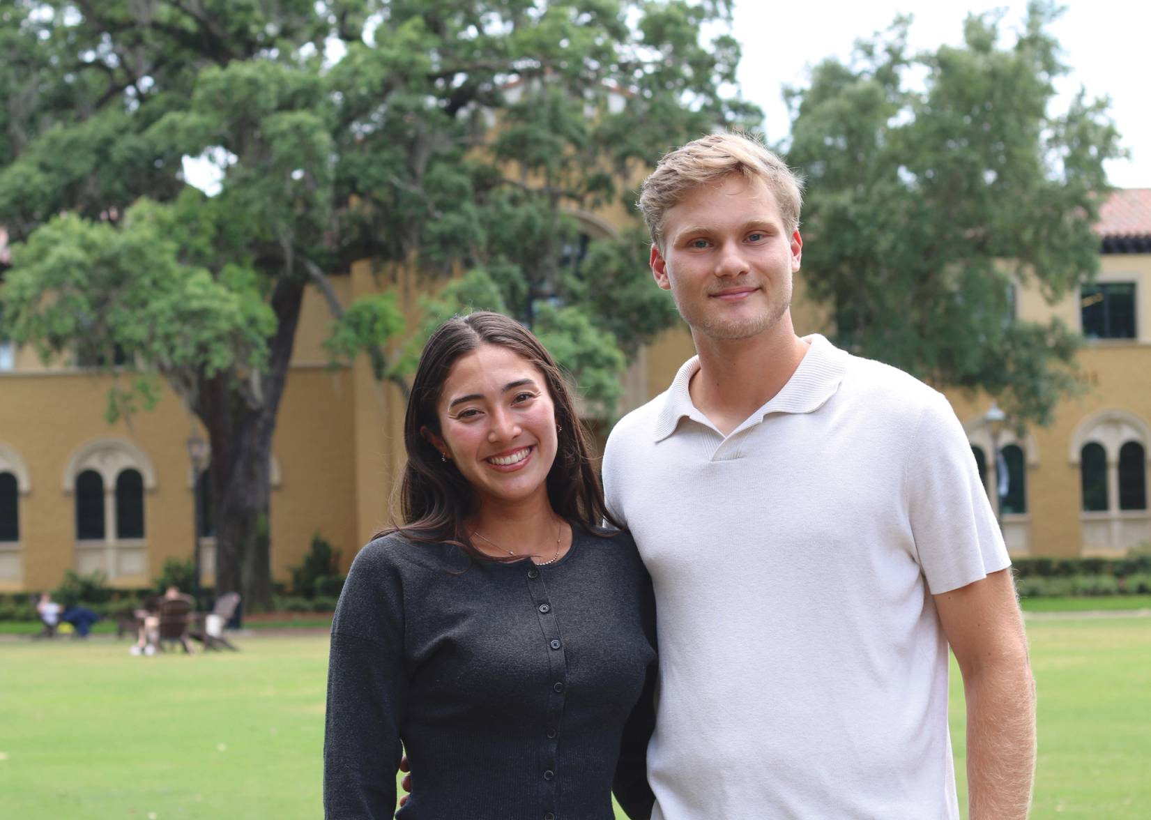 Sydney Eckstein (left) Richard Stoiberer (right) arm in arm on Mills lawn at Rollins College