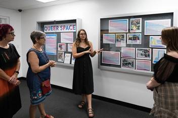 Student presenting historical research exhibit on local LGBTQ history at The Center Orlando.