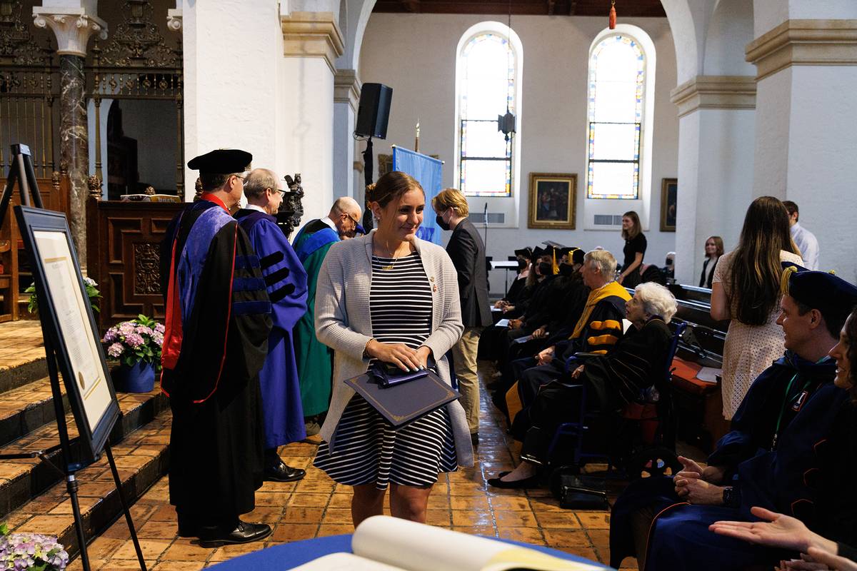 A student is honored during Phi Beta Kappa induction ceremony.