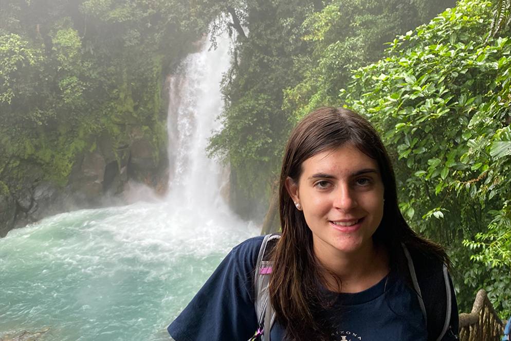 Sophia Watson in front of a waterfall.