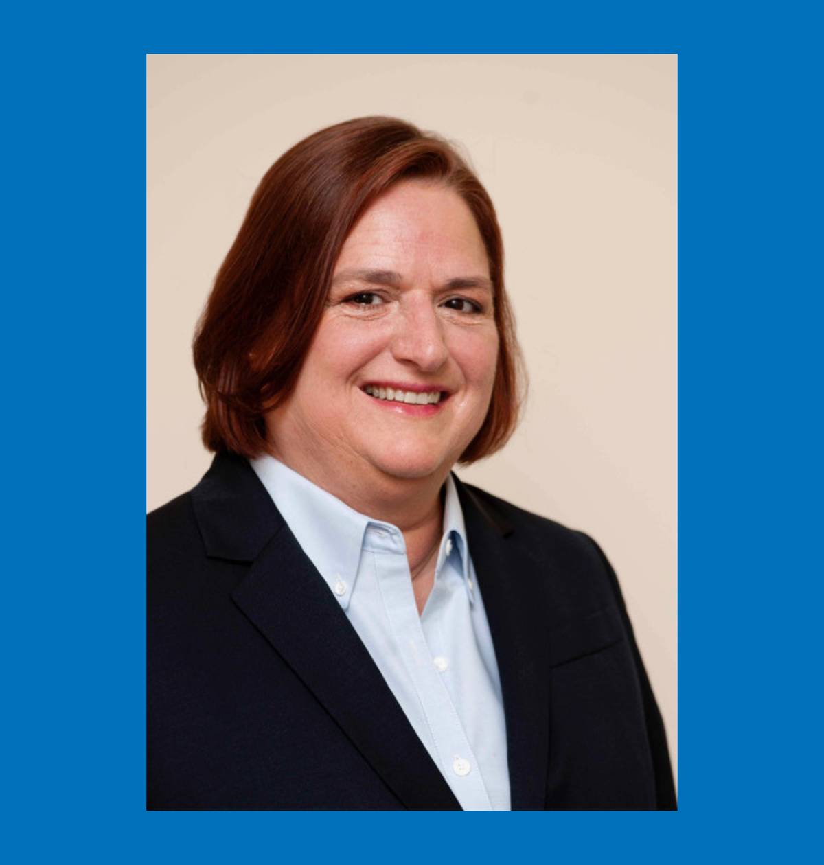 Headshot of Laurie Strehl smiling and wearing professional attire.