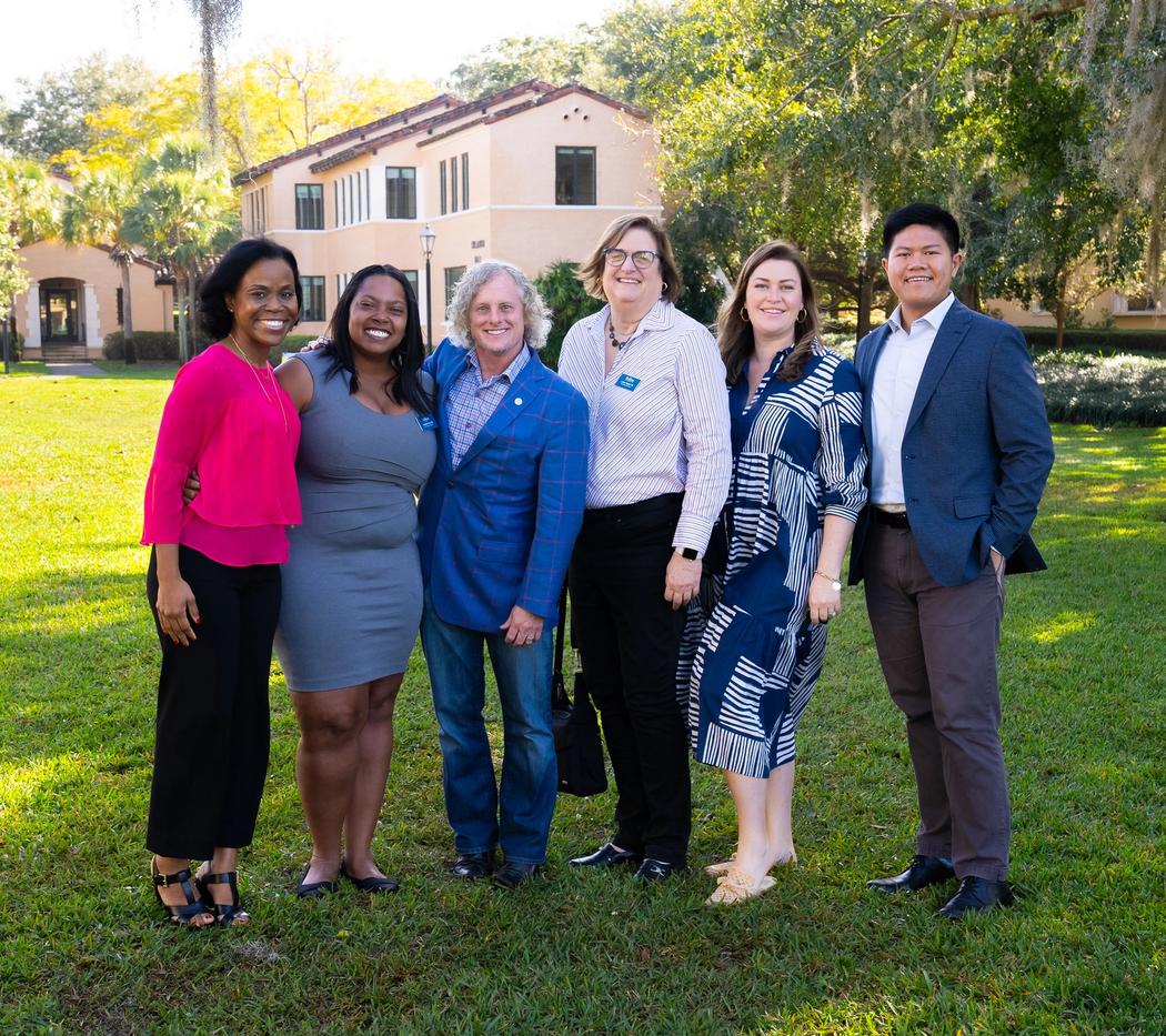 The Executive Committee of the alumni board, outside on the lawn at Rollins College