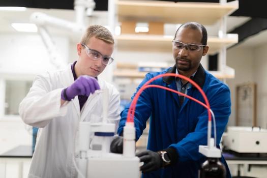 student and faculty working together in a chemistry lab