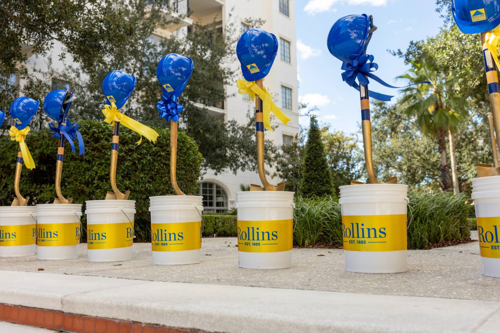 shovels in buckets, with hardhats ready for groundbreaking