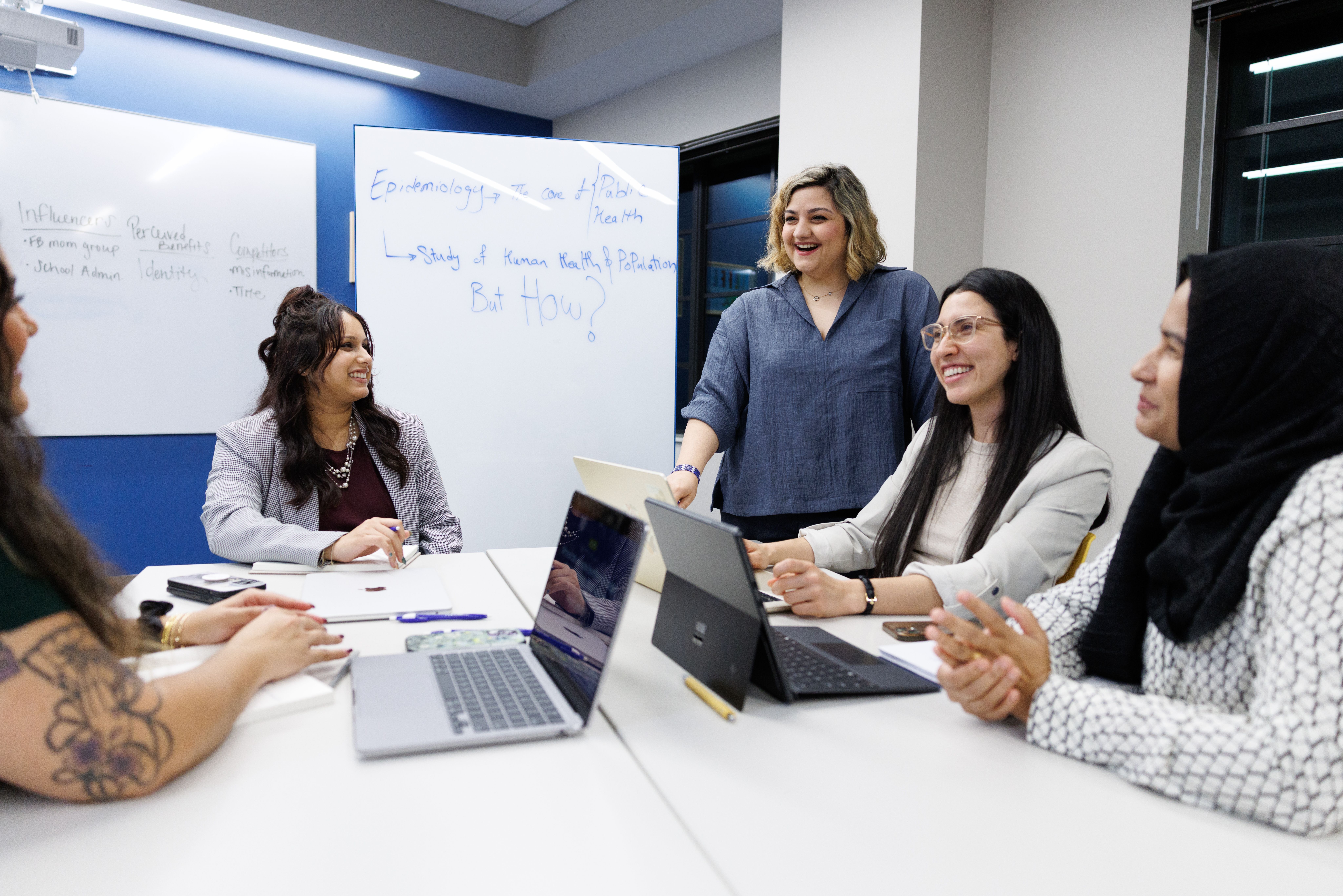 Students and professor engaging in a classroom. 