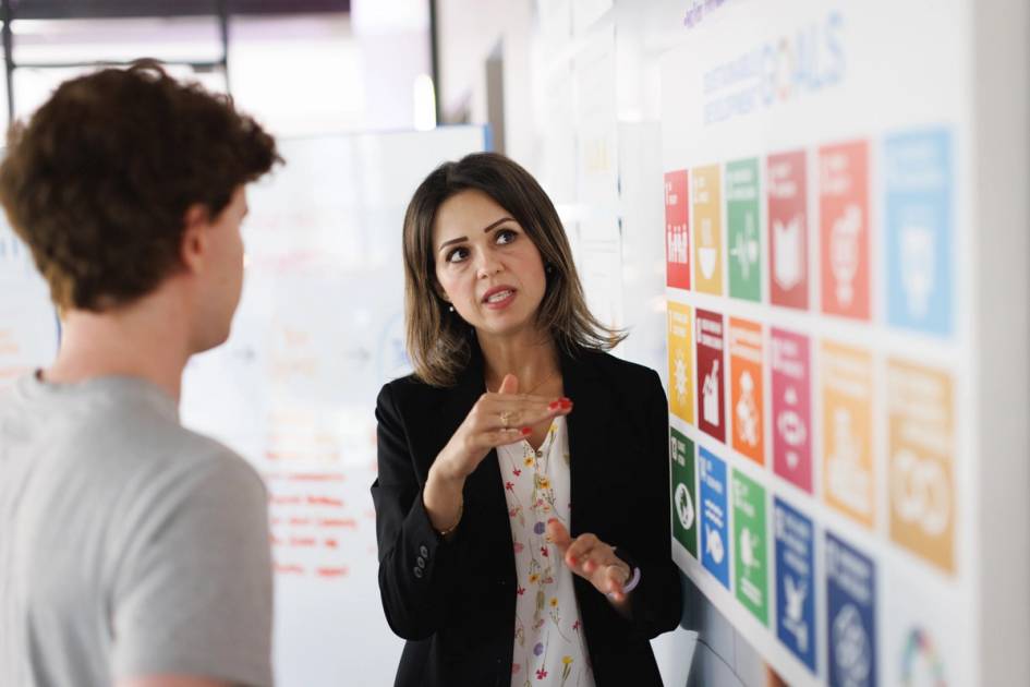 Serina Haddad, PhD, a Rollins College Business professor talks with a student.