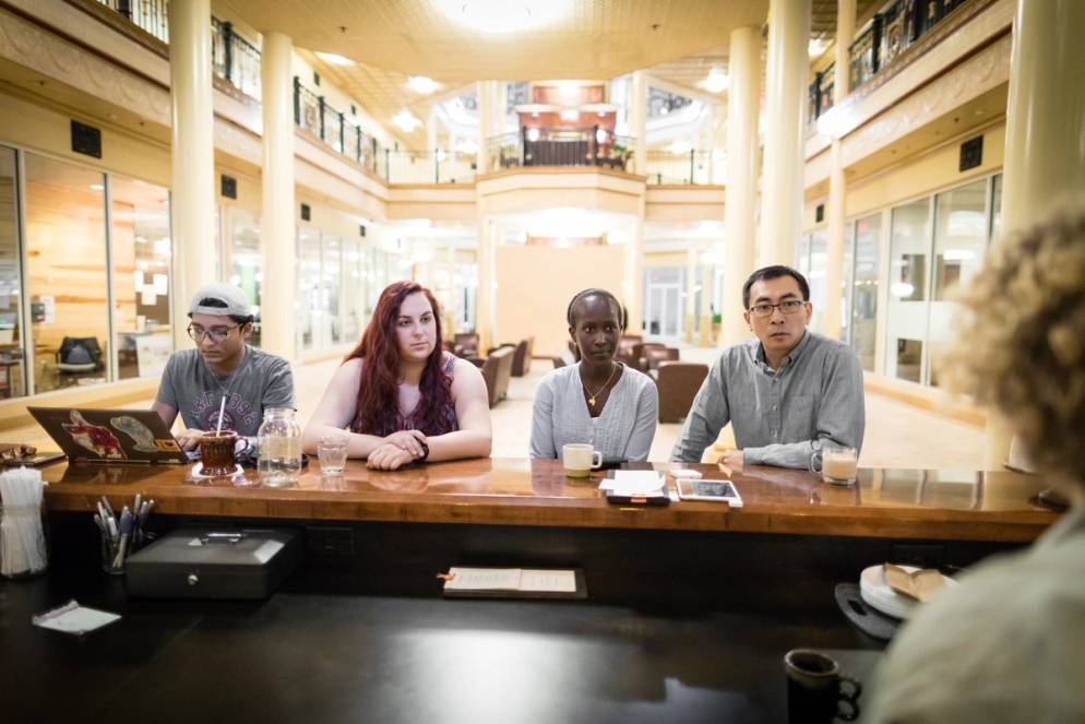 Dr. Peng and his students sitting at the bar at Downtown Credo.