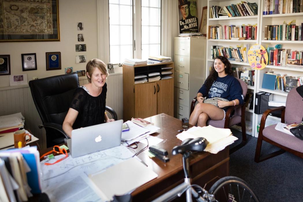 Rollins English student meets with professor in their office.