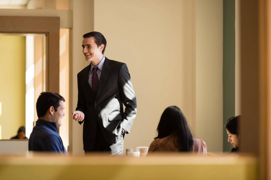 A business professor leads a class discussion.