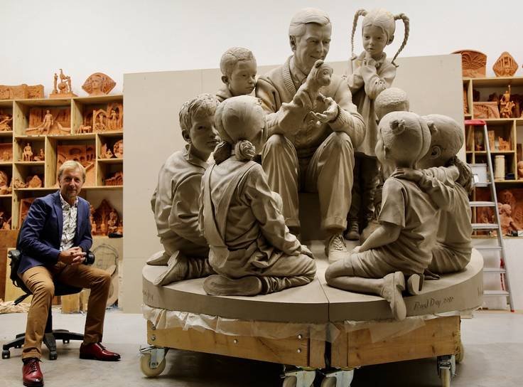 Artist Paul Day pictured with the unfinished sculpture of Mister Rogers for Rollins College.