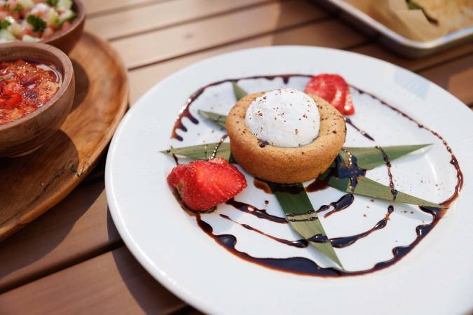 Chocolate chip cookie with chocolate sauce and strawberries from Dave's Boathouse.