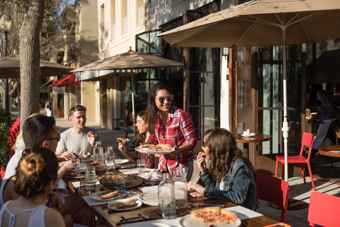 Rollins students dining at Prato on Park Avenue, one of Winter Park’s favorite chef-driven local restaurants.