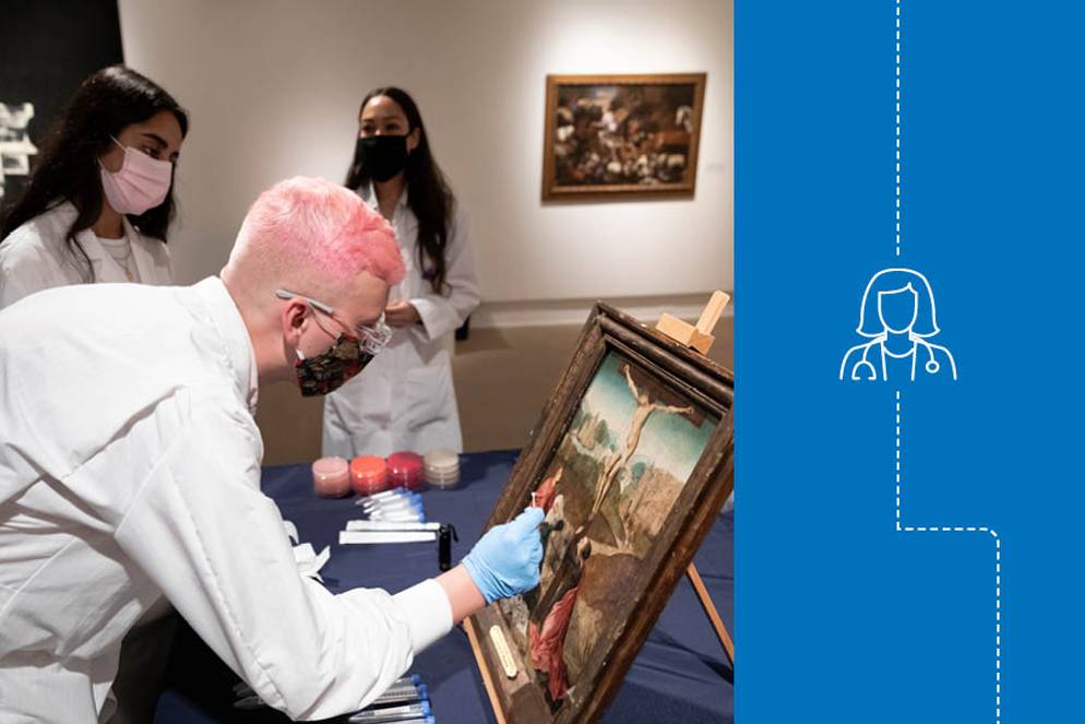 Isaac Gorres ’21 applies a biological solution to the pigments of an Old Master painting.