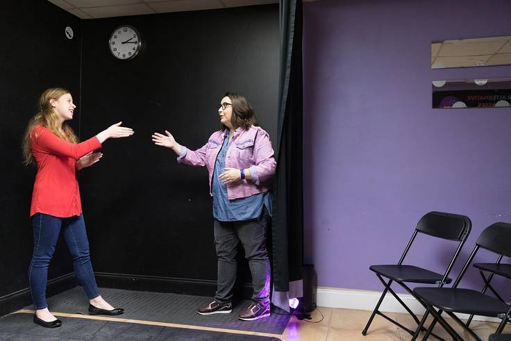 AnnMarie Morrison ’20 and Lauren Morris ’99, a Rollins student and a Rollins grad, perform improv exercises in a Winter Park, Florida, theatre. 