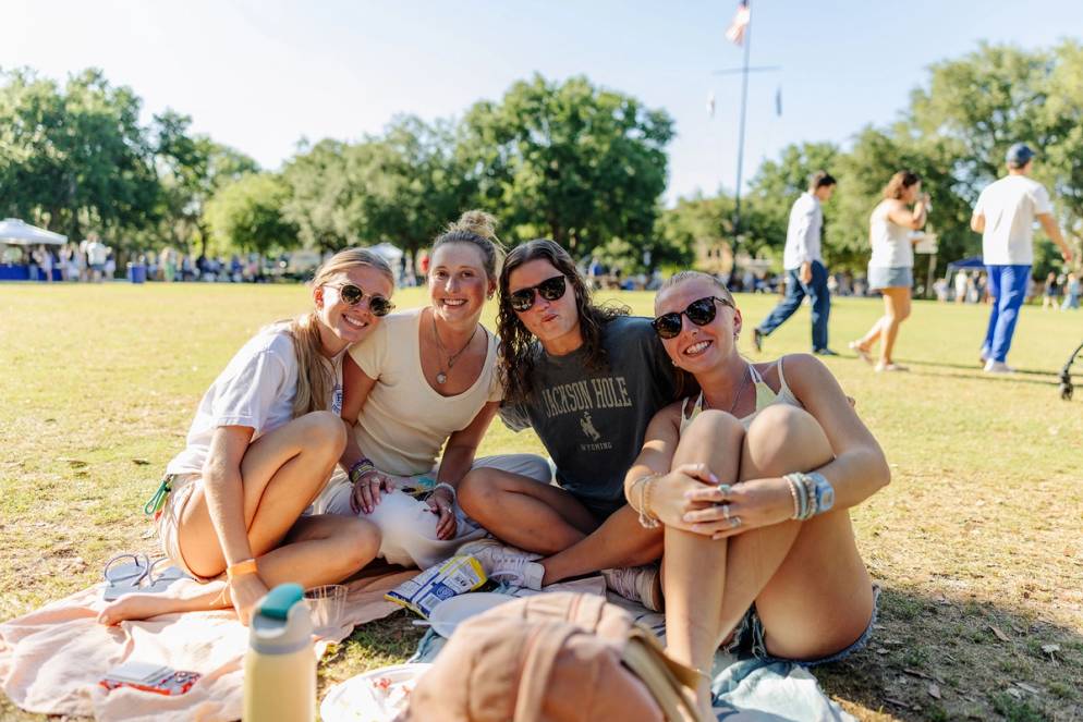 Students eating and enjoying the picnic out on Mills Lawn