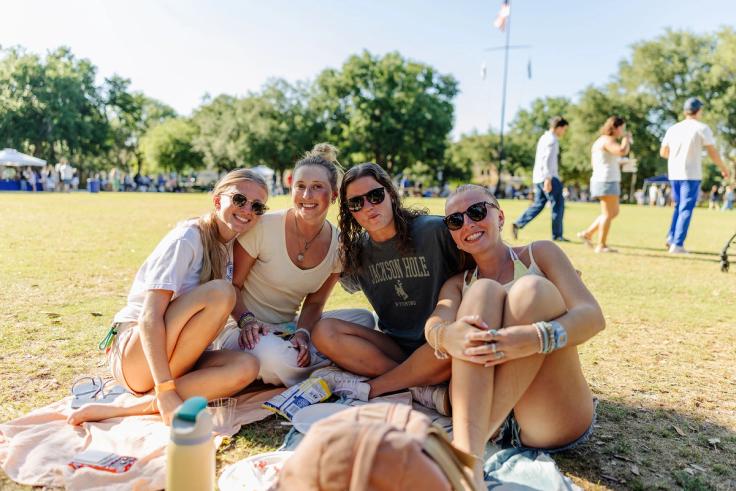 Students eating and enjoying the picnic out on Mills Lawn