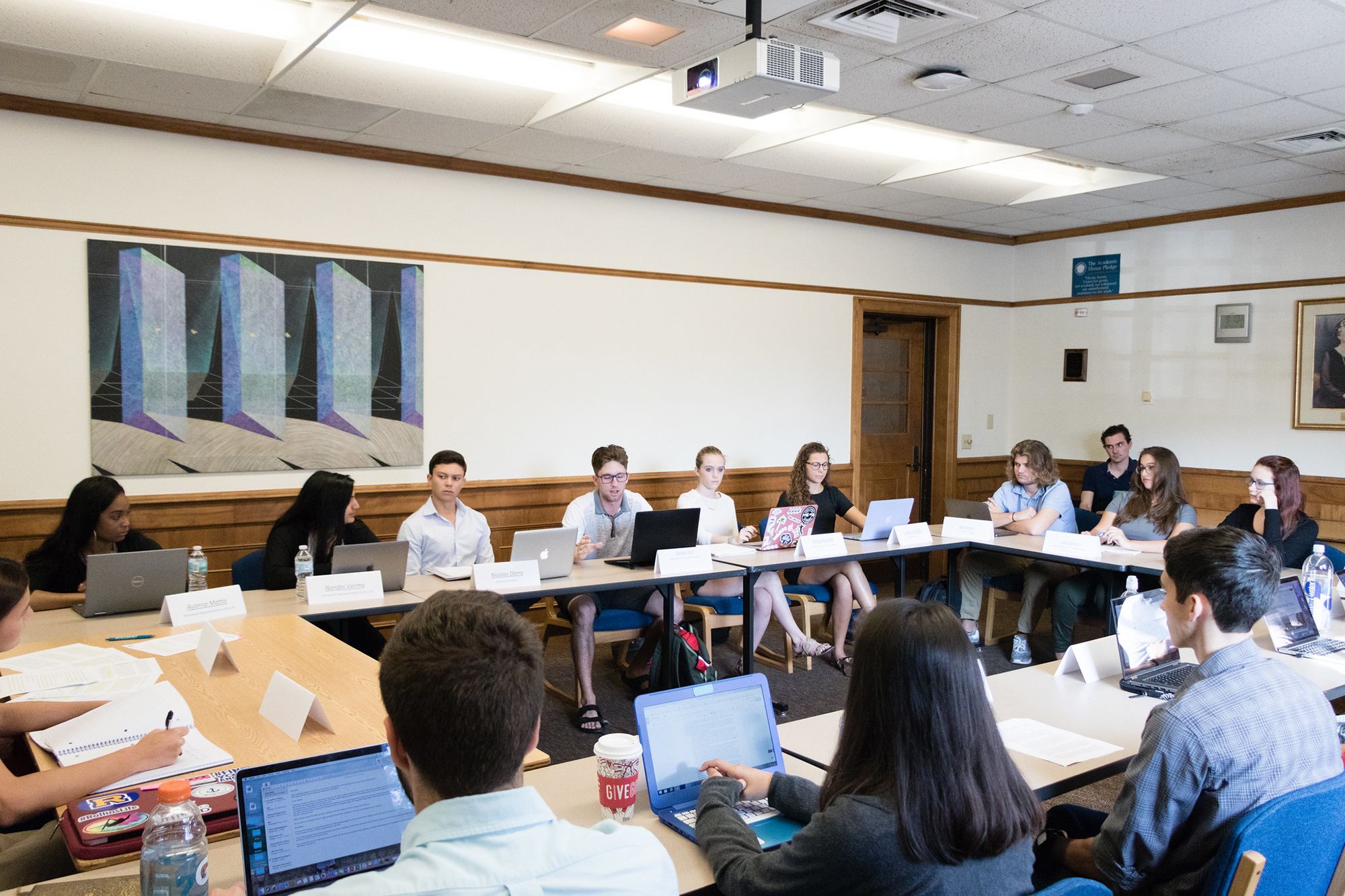 The Globalization class students seated at tables in a large circle.